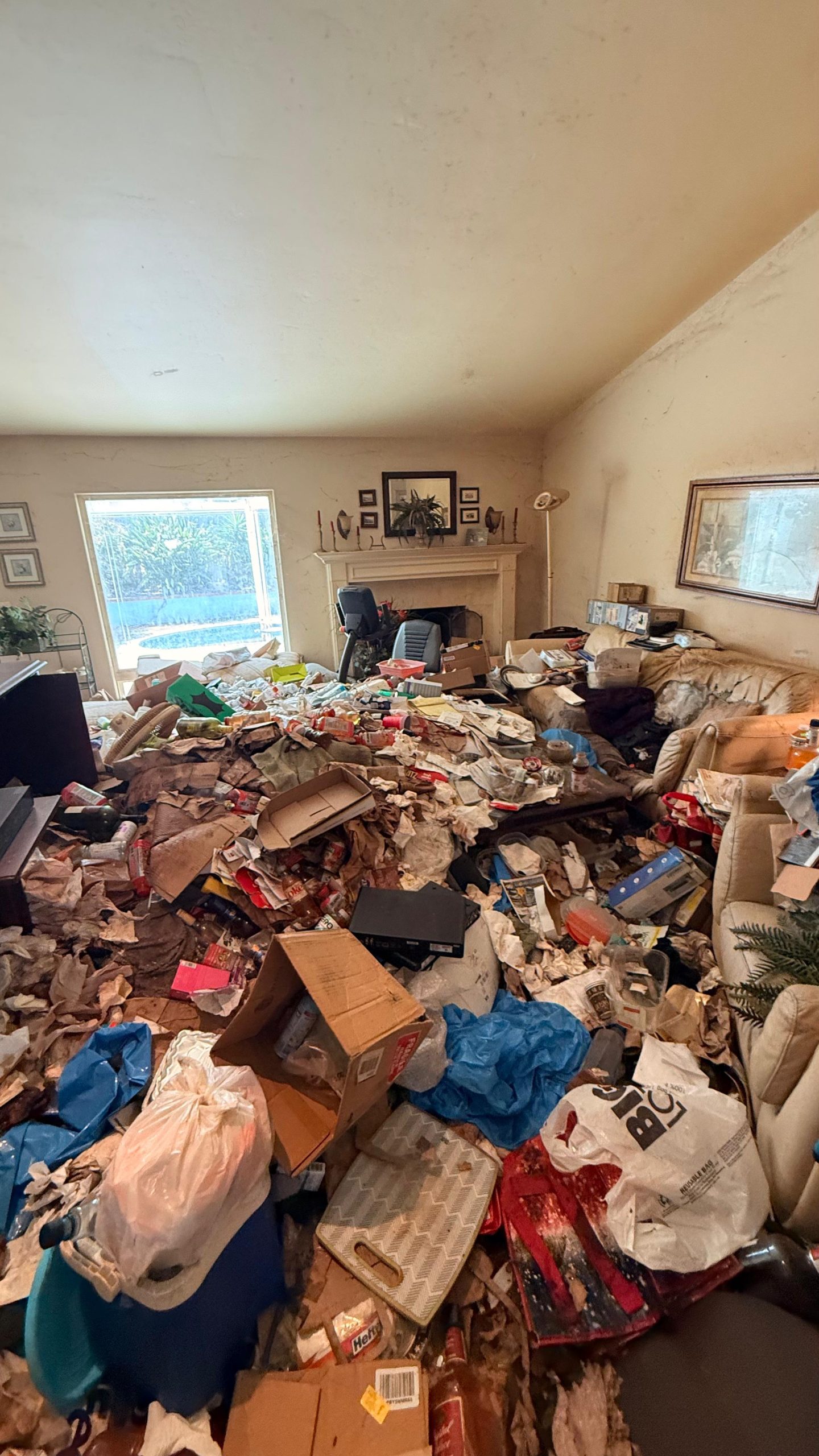 Massive hoarder cleanout debris loading phase in Orange County